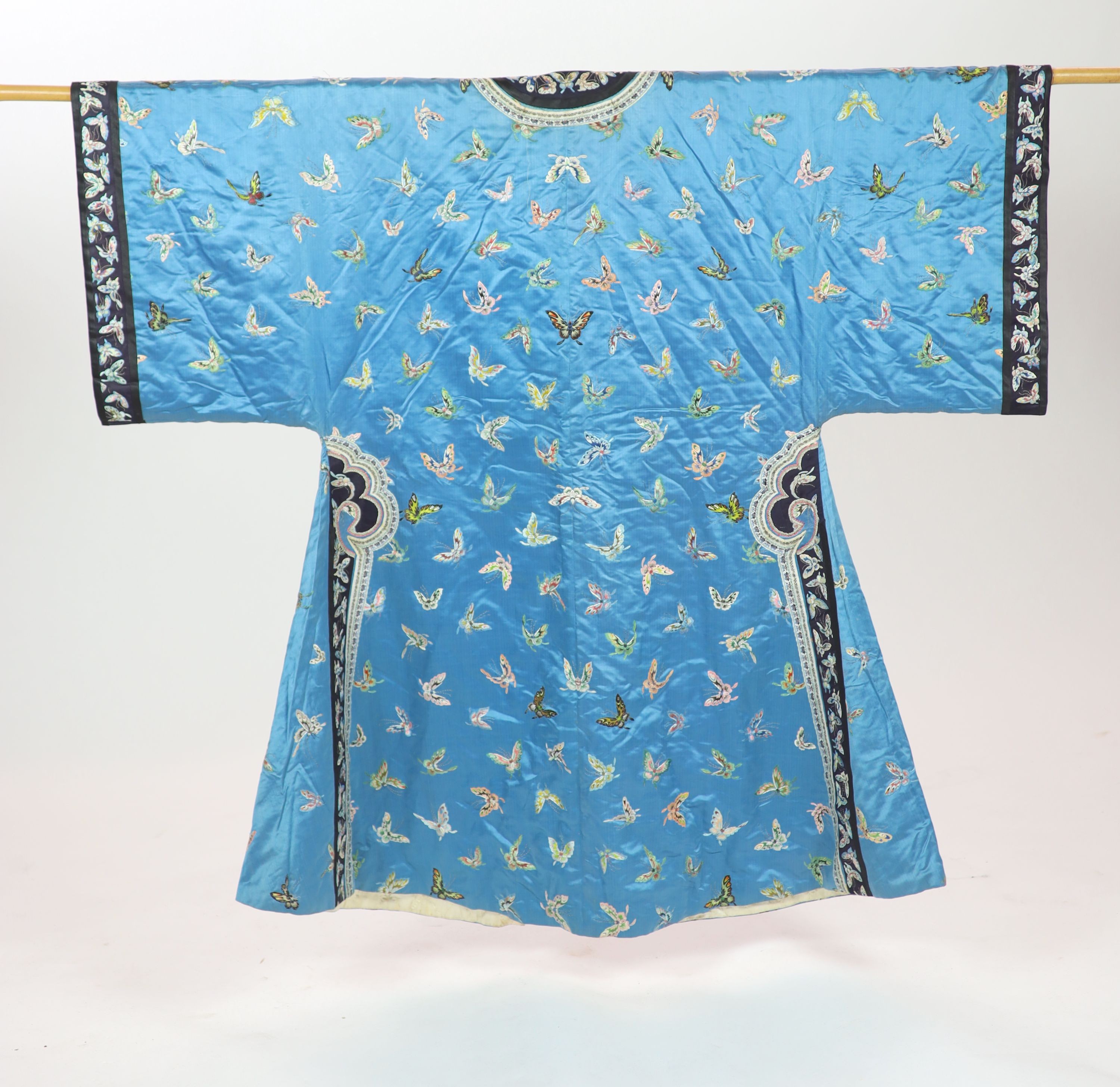 A Chinese blue silk ‘butterfly’ Winter robe, late 19th century, 132cm drop
